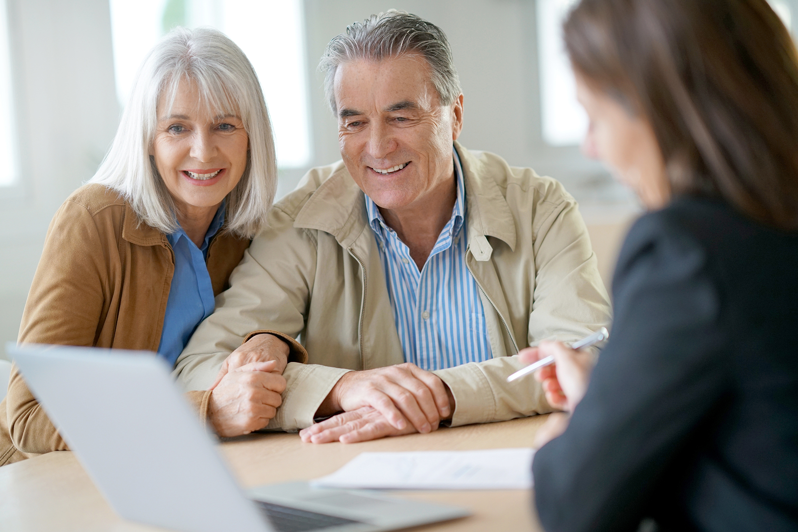 Senior couple meeting financial adviser for investment Social Security Earnings Test
